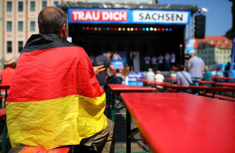 Supporters attend an election campaign of Germany's far-right Alternative For Germany (AFD) party ahead of Saxony state elections in Dresden, Germany, August 25, 2019. (photo credit: HANNIBAL HANSCHKE/REUTERS)
