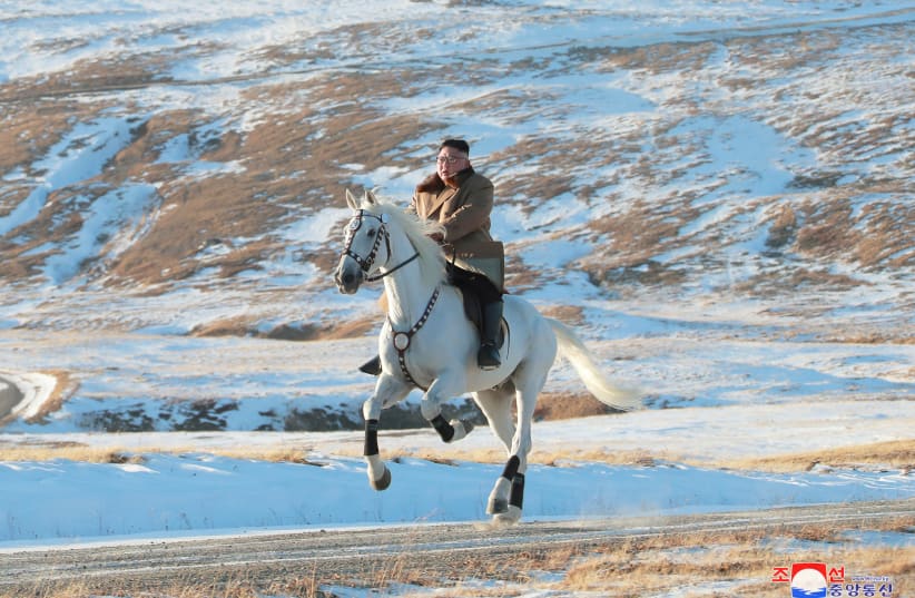 North Korean leader Kim Jong Un rides a horse during snowfall in Mount Paektu (photo credit: KCNA/VIA REUTERS)