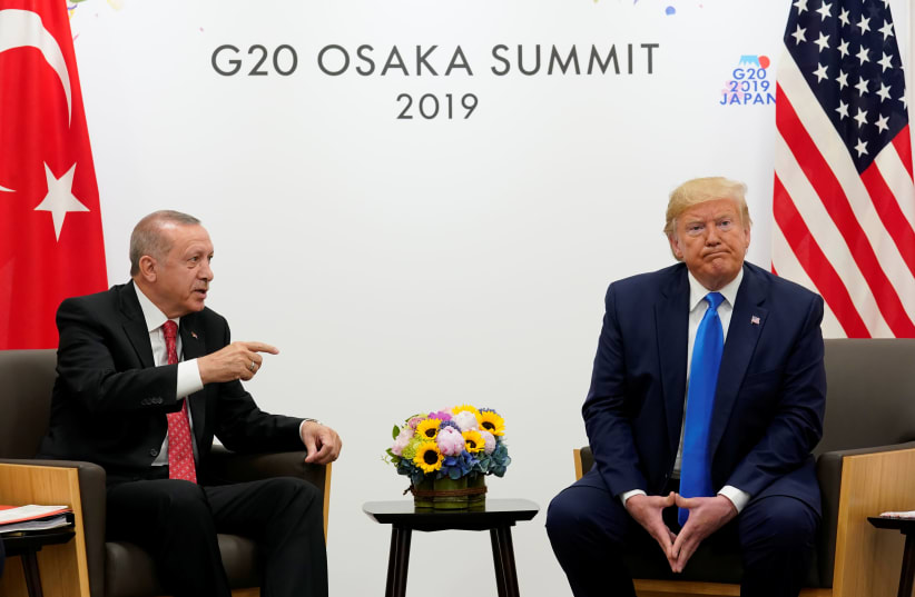 U.S. President Donald Trump attends a bilateral meeting with Turkey's President Tayyip Erdogan during the G20 leaders summit in Osaka, Japan, June 29, 2019 (photo credit: REUTERS/KEVIN LAMARQUE)