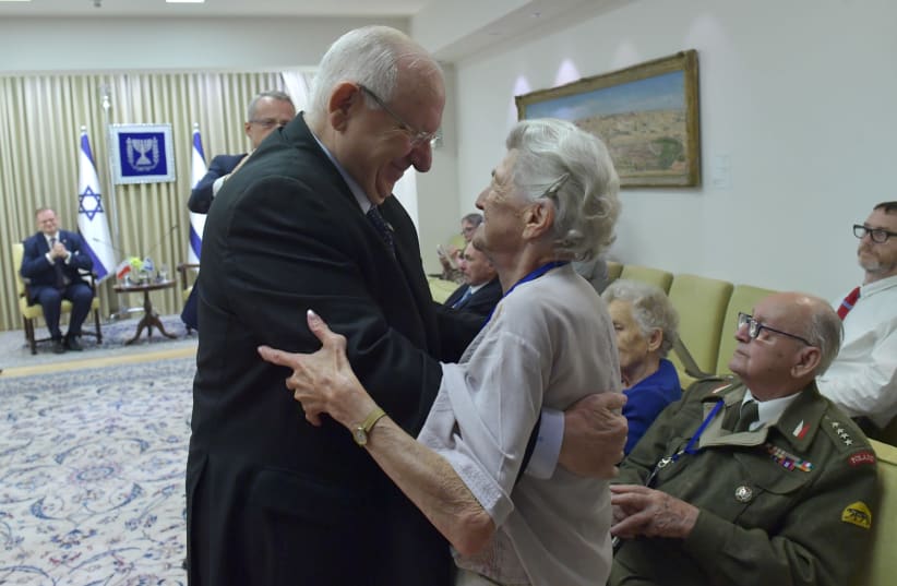 President Rivlin embraces Janina Rosciszewska  whose family saved seven Jews during the Holocaust (photo credit: KOBI GIDEON/GPO)