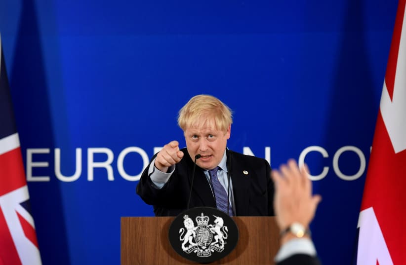 Britain's Prime Minister Boris Johnson takes questions during a news conference at the European Union leaders summit dominated by Brexit, in Brussels, Belgium October 17, 2019 (photo credit: REUTERS/TOBY MELVILLE)