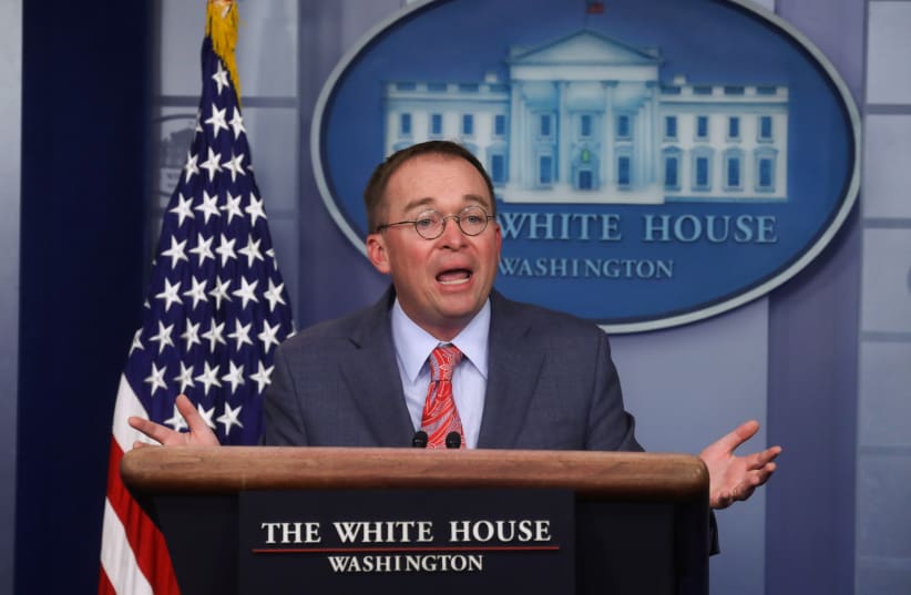 Acting White House Chief of Staff Mick Mulvaney answers questions from reporters during a news briefing at the White House in Washington, U.S., October 17, 2019 (photo credit: REUTERS/LEAH MILLIS)