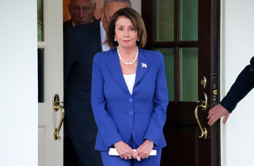 U.S. House Speaker Nancy Pelosi (D-CA) walks out with Senate Minority Leader Chuck Schumer (D-NY) and House Majority Leader Steny Hoyer (D-MD) to speak with reporters after meeting with President Trump at the White House in Washington, U.S. October 16, 2019 (photo credit: REUTERS/JONATHAN ERNST)