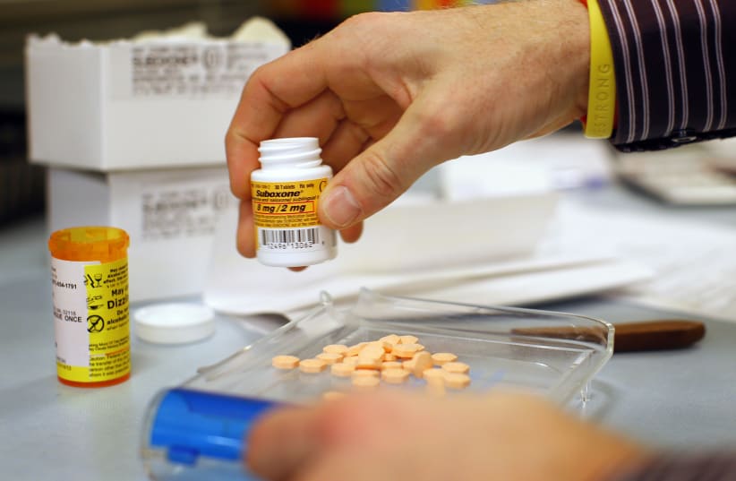 Pharmacist Jim Pearce fills a Suboxone prescription at Boston Healthcare for the Homeless Program in Boston (photo credit: REUTERS)