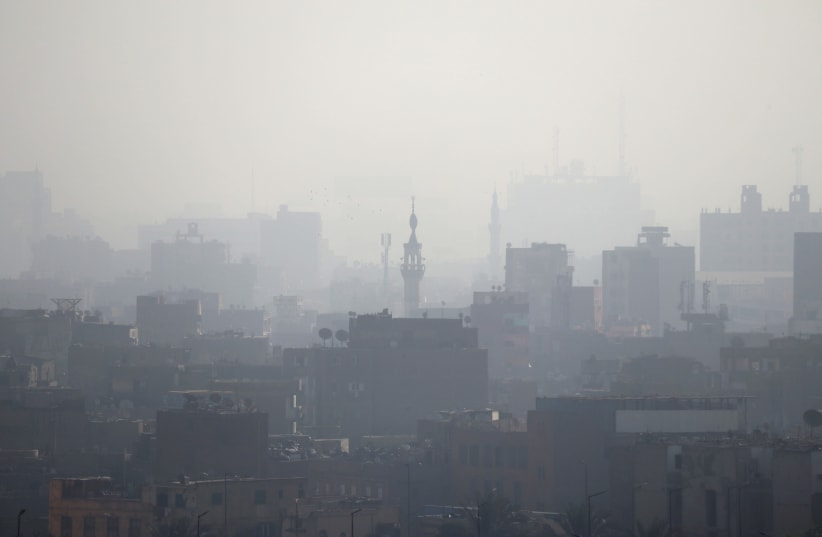 A minaret is seen through early morning haze on the skyline of Cairo, Egypt March 21, 2018 (photo credit: REUTERS/RUSSELL BOYCE)