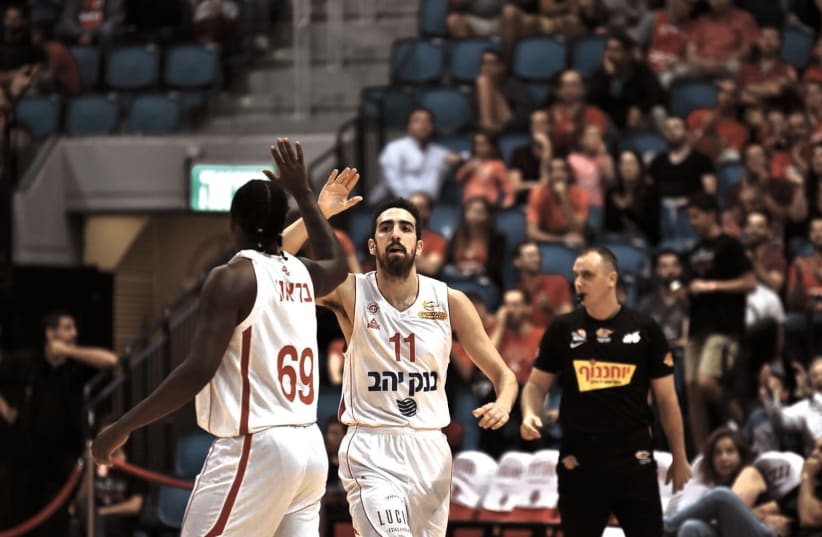 ALMOST AS much as his on-court production, Hapoel Jerusalem will need to rely on new team captain Bar Timor (11) for his leadership abilities (photo credit: DOV HALICKMAN PHOTOGRAPHY)