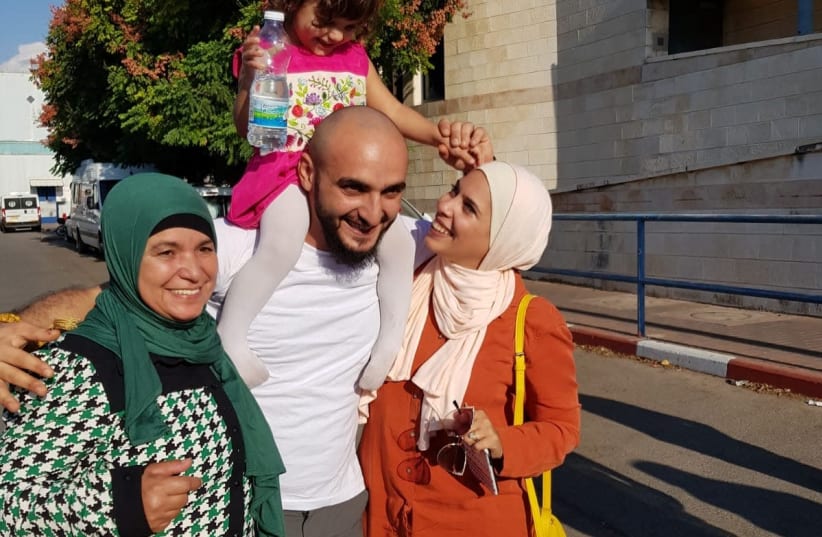 Mustafa and family (photo credit: COURTESY HAMOKED)