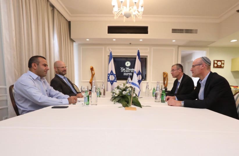 Likud and Blue and White negotiation teams (photo credit: ELAD MALKA)