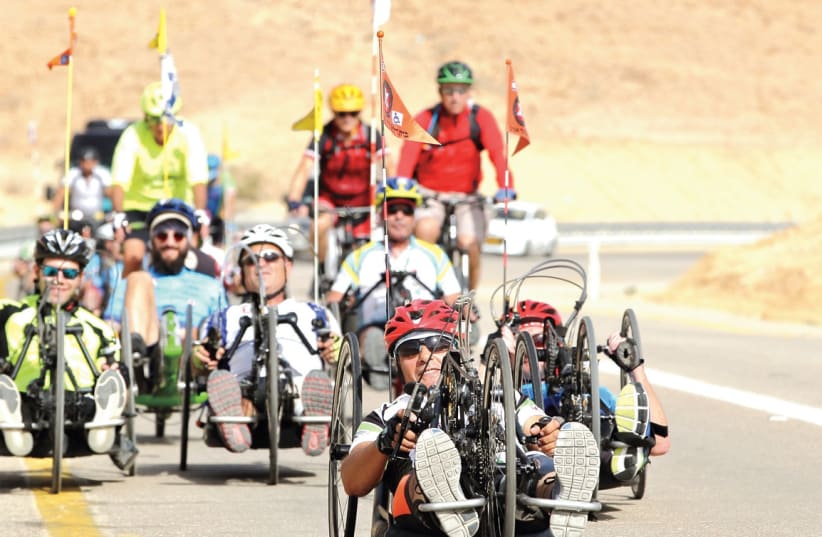 DISABLED CYCLISTS take part in the Beit Halochem Canada, Aid to Disabled Veterans of Israel race this week in Israel.  (photo credit: IDAN PELED/COURTESY)