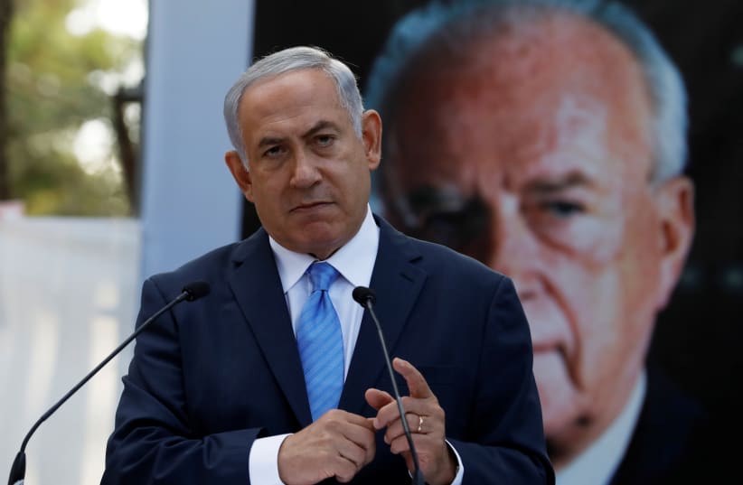 Israel's Prime Minister Benjamin Netanyahu attends a memorial ceremony for the late prime minister Yitzhak Rabin at Mount Herzl military cemetery in Jerusalem as Israel marks the 22nd anniversary of Rabin's killing by an ultra-nationalist Jewish assassin, November 1, 2017 (photo credit: REUTERS/Ronen Zvulun)