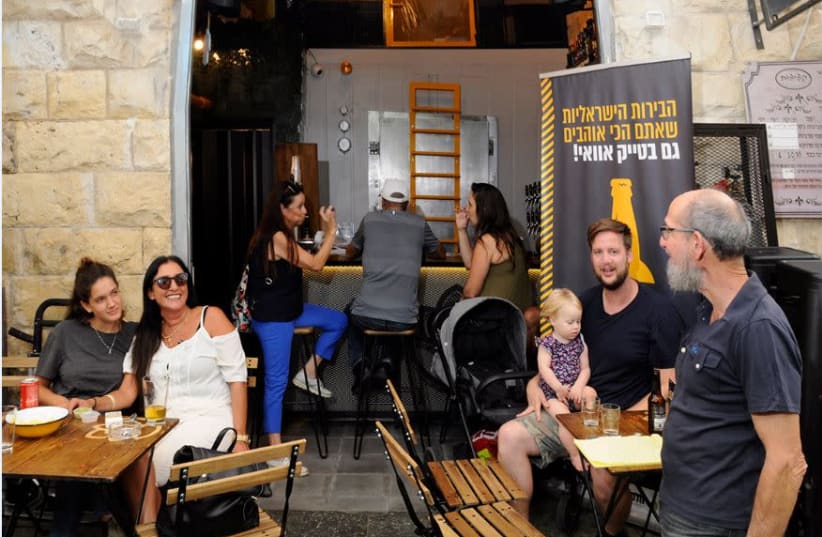 A WELCOME relative newcomer in the shuk, Beer Market specializes in local and craft beers at reasonable prices. (photo credit: MIKE HORTON)