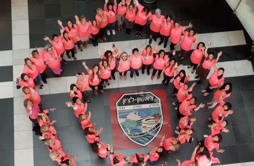 Rishon Lezion Municipality workers wear pink in honor of Breast Cancer Awareness Month. (photo credit: GAL ABHAEL)