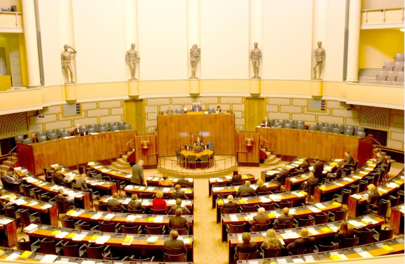 Legislators deliberate in the Session Hall of Parliament of Finland (photo credit: Wikimedia Commons)