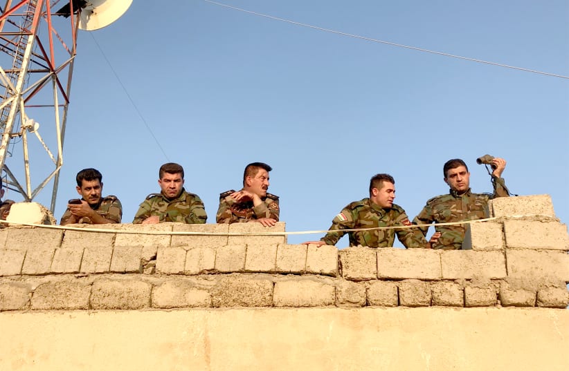 KURDISH PESHMERGA troops overlooking ISIS-held territory in September. (photo credit: SETH J. FRANTZMAN)