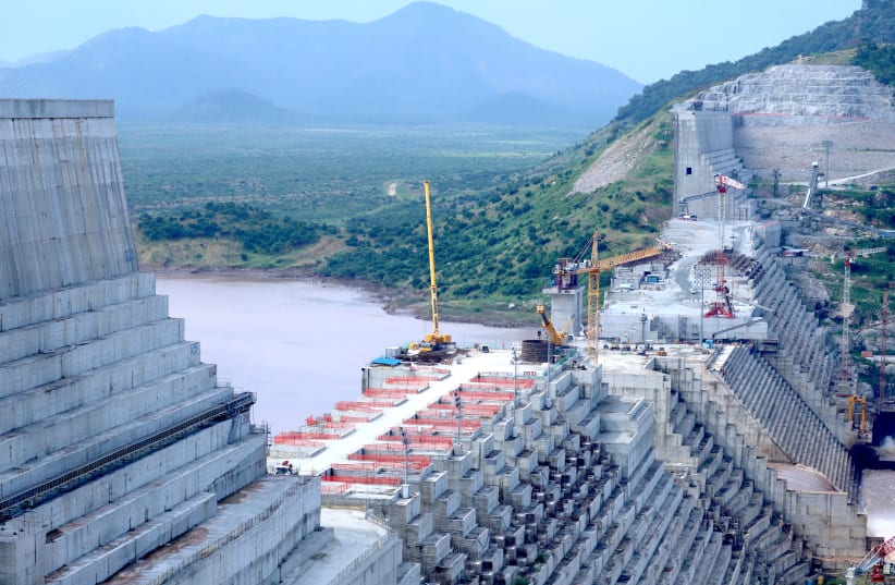 ETHIOPIA’S GRAND Renaissance Dam undergoes construction work on the Nile River in Benishangul Gumuz Region, Ethiopia, on  September 26.  (Tiksa Negeri/File Photo/Reuters) (photo credit: TIKSA NEGERI / REUTERS)