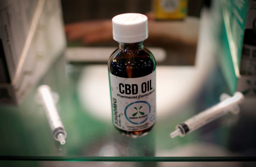CBD oil is seen displayed at The Cannabis World Congress & Business Exposition (CWCBExpo) trade show (photo credit: MIKE SEGAR / REUTERS)