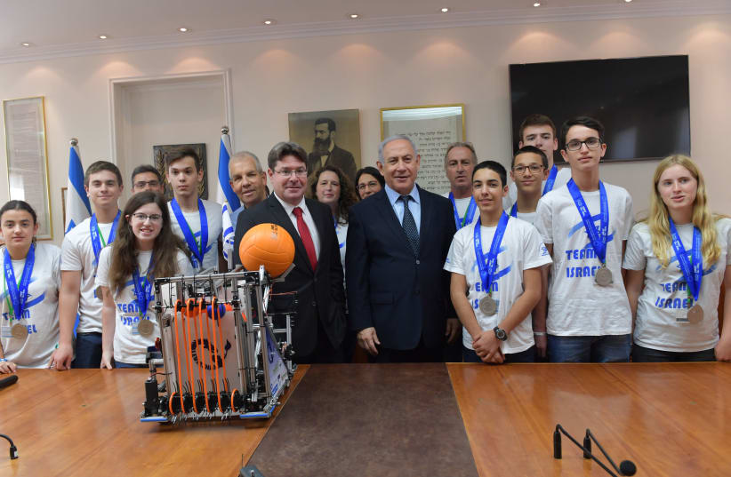 rime Minister Benjamin Netanyahu and Minister of Science and Technology Ofir Akunis meet with the Israeli robotics team (photo credit: KOBI GIDON / GPO)