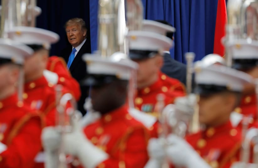 U.S. President Donald Trump arrives for a Veterans Day Parade and Wreath Laying ceremony in Manhattan, New York City, U.S., November 11, 2019 (photo credit: ANDREW KELLY / REUTERS)