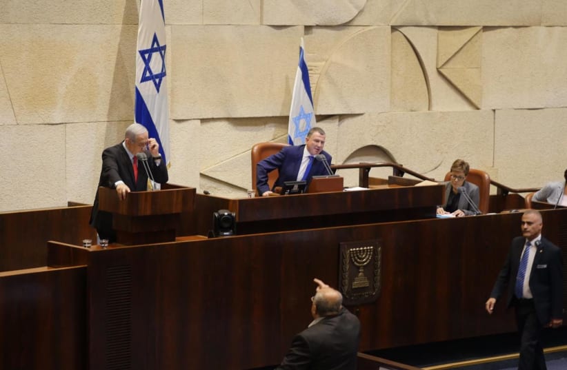Joint List MK Ahmad Tibi (below) yells at Prime Minister Benjamin Netanyahu at the Knesset on Wednesday (photo credit: KNESSET)