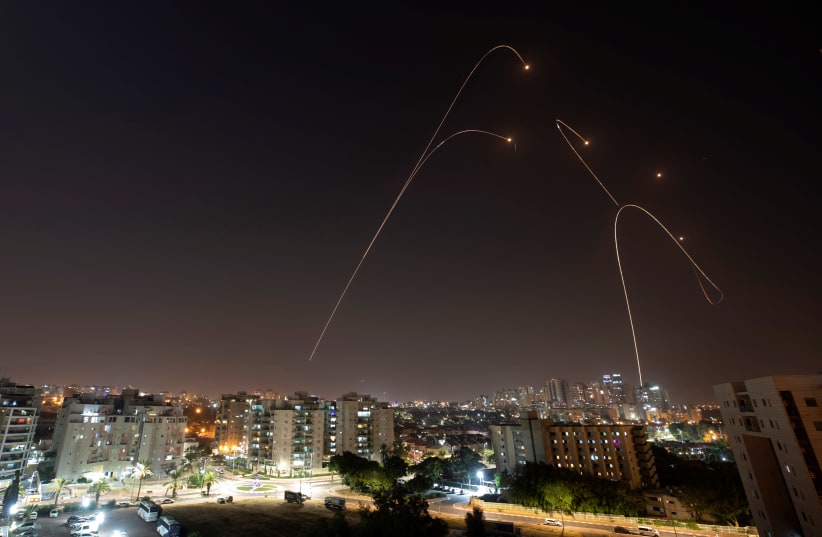 Iron Dome anti-missile system fires interception missiles as rockets are launched from Gaza towards Israel (photo credit: AMIR COHEN/REUTERS)