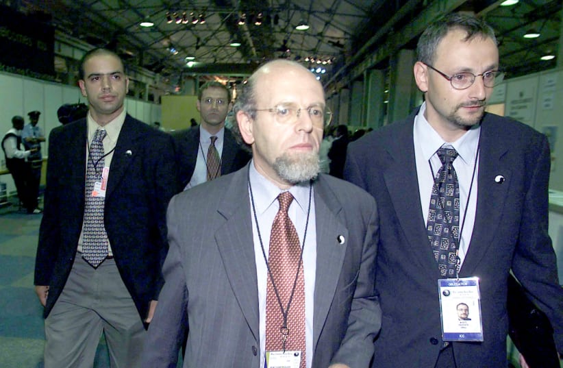 Israeli officials exit the World Conference Against Racism in Durban, 2001, protesting attempts to single out Israel as a racist state.  (photo credit: JUDA NGWENYA / REUTERS)