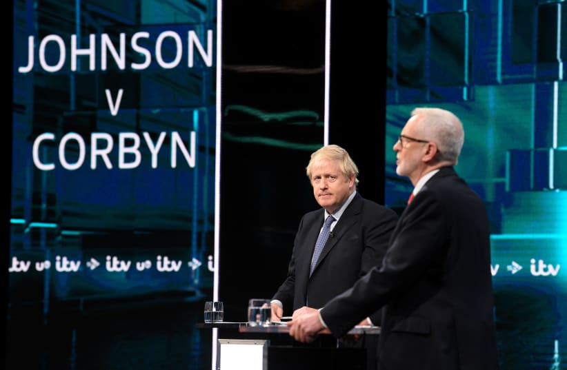 Conservative leader Boris Johnson and Labour leader Jeremy Corbyn are seen during a televised debate ahead of general election in London, Britain, November 19, 2019 (photo credit: JONATHAN HORDLE/ITV/HANDOUT VIA REUTERS)