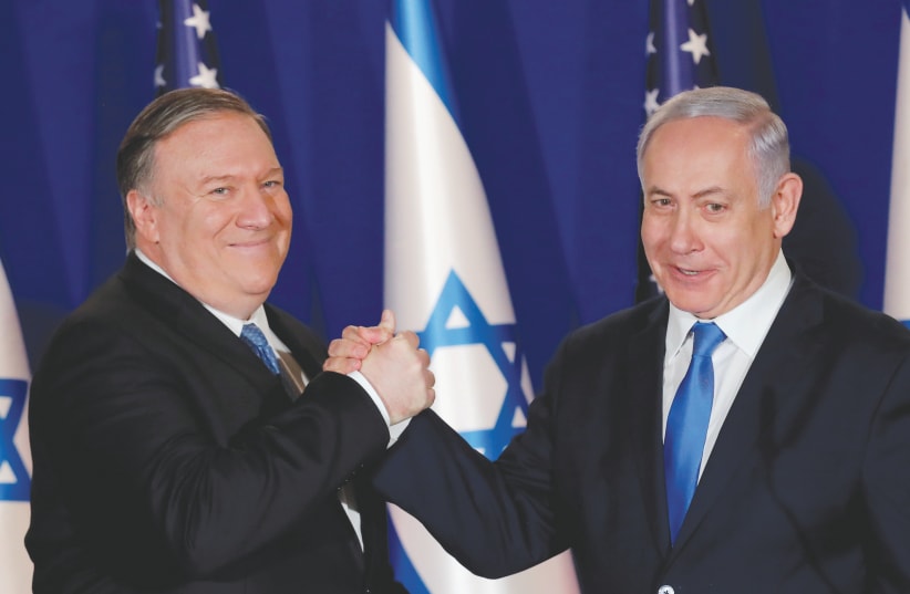 US SECRETARY OF STATE Mike Pompeo shake hands with Prime Minister Benjamin Netanyahu in Jerusalem earlier this year.  Can the US administration be taken seriously when it comes to their interpretation of international law?  (photo credit: JIM YOUNG/REUTERS)