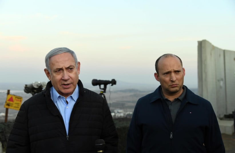 Prime Minister Benjamin Netanyahu and Defense Minister Naftali Bennett tour Mount Avital in the Golan Heights (photo credit: HAIM ZACH/GPO)