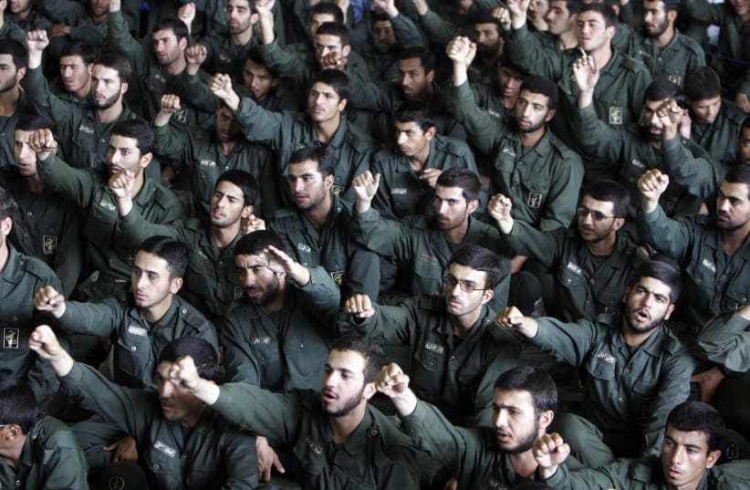 Iranian revolutionary guard corps chant slogans in support of Iran's nuclear programme during Friday prayers in Tehran (photo credit: RAHEB HOMAVANDI/REUTERS)