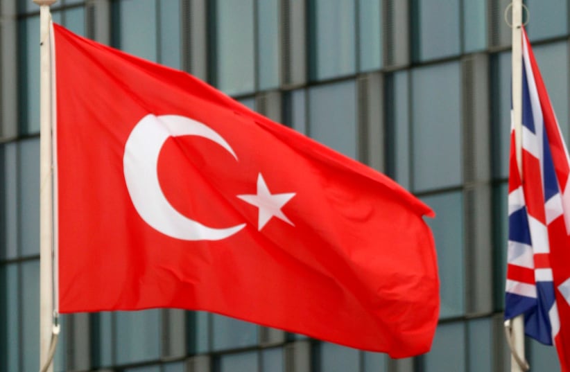 Turkish flag flutters at the Alliance headquarters in Brussels, Belgium, (photo credit: REUTERS/FRANCOIS LENOIR)