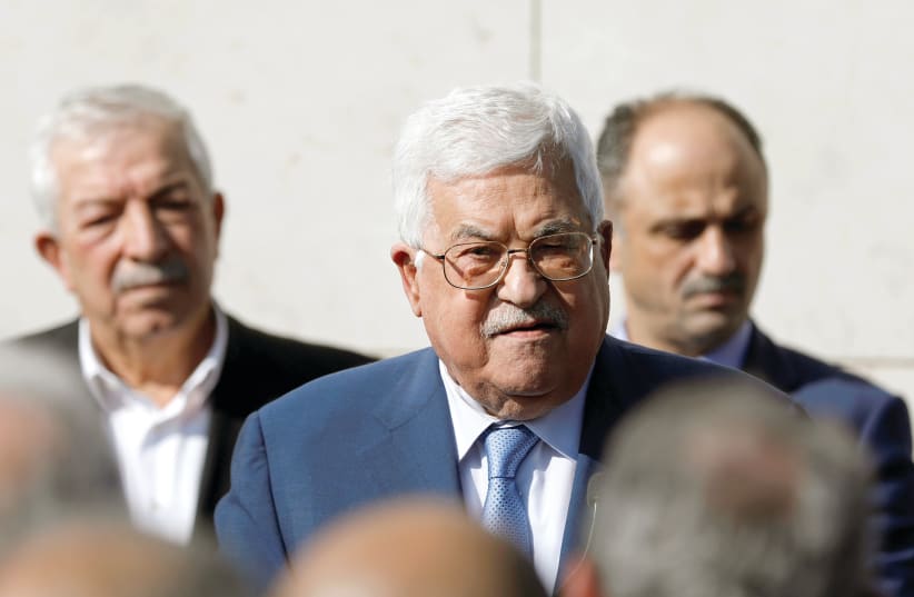 PALESTINIAN PRESIDENT Mahmoud Abbas attends a ceremony marking the 15th anniversary of the death of his predecessor Yasser Arafat, in Ramallah in the Israeli-occupied West Bank.  (photo credit: REUTERS)