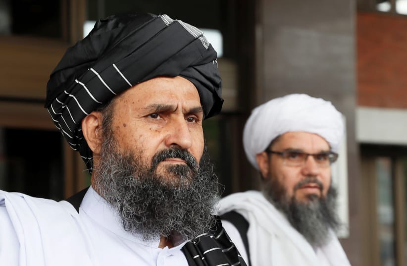 Taliban chief negotiator Mullah Abdul Ghani Baradar (front) leaves after peace talks with Afghan senior politicians in Moscow, Russia May 30, 2019 (photo credit: REUTERS/EVGENIA NOVOZHENINA)