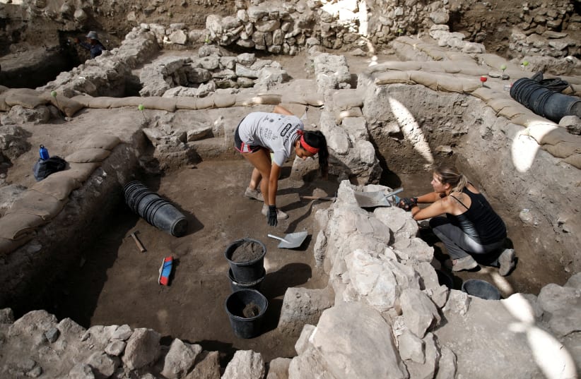 Workers dig at the Tel Megiddo Archaeological site in northern Israel July 24, 2018. (photo credit: AMIR COHEN/REUTERS)