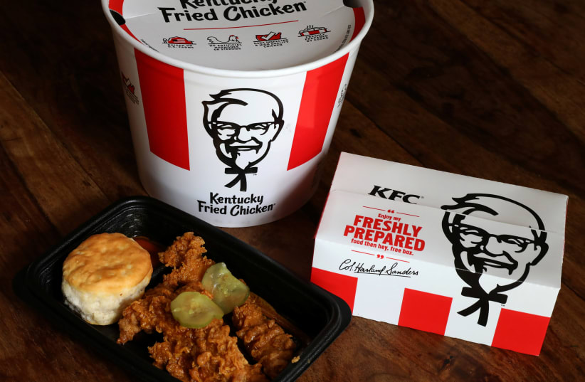Kentucky Fried Chicken (KFC) tenders, a bucket and box of chicken are seen in this picture illustration (photo credit: CARLO ALLEGRI/REUTERS)