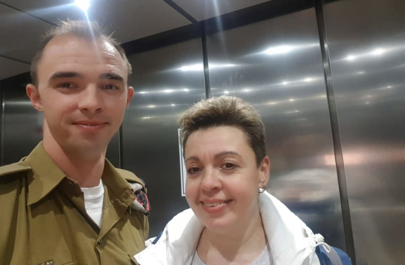 Mother and son Maxim and Tatiana Popovich reunite at Ben-Gurion Airport.   (photo credit: Courtesy)