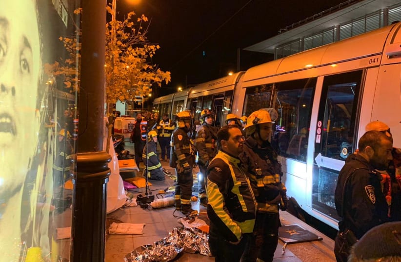 Fire and Rescue workers next to the light rail in Jerusalem where a 19-year-old woman was killed (photo credit: FIRE AND RESCUE SERVICE)