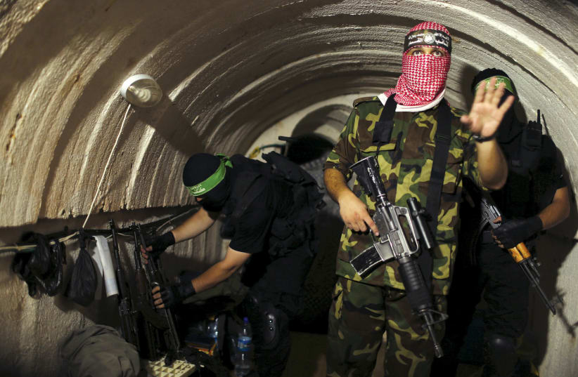A HAMAS member in a tunnel during the 2014 war (photo credit: REUTERS)
