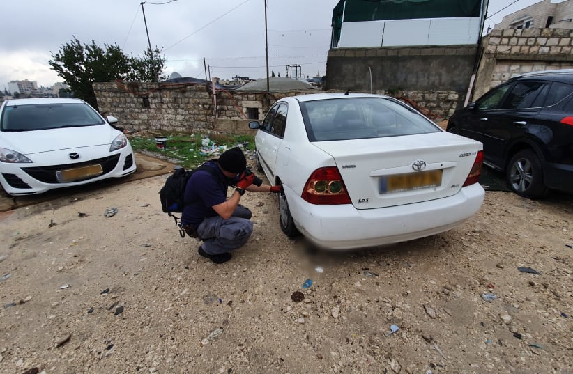 Police investigate suspected price tag attack in Jerusalem's Shu'afat neighborhood on December 9, 2019 (photo credit: ISRAEL POLICE)