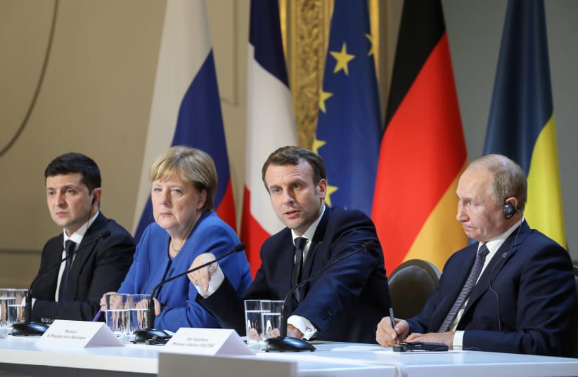 Ukrainian President Volodymyr Zelenskiy, German Chancellor Angela Merkel, French President Emmanuel Macron and Russian President Vladimir Putin give a press conference after a summit on Ukraine at the Elysee Palace in Paris, December 9, 2019 (photo credit: LUDOVIC MARIN/POOL VIA REUTERS)