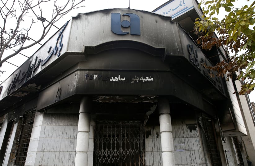 A burnt bank is seen after protests against increased fuel prices in Tehran, Iran November 20, 2019. Picture taken November 20, 2019 (photo credit: NAZANIN TABATABAEE/WANA (WEST ASIA NEWS AGENCY) VIA REUTERS)