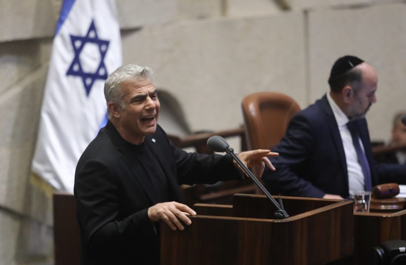 Blue and White leader Yair Lapid speaking at the Knesset on December 11 2019  (photo credit: MARC ISRAEL SELLEM)