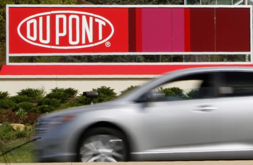 A view of the Dupont logo on a sign at the Dupont Chestnut Run Plaza facility near Wilmington, Delaware (photo credit: REUTERS/TIM SHAFFER)