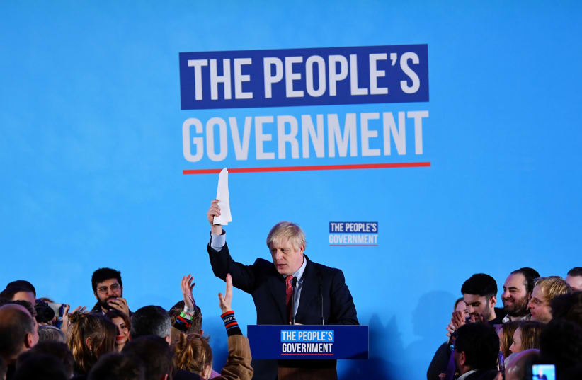 Britain's Prime Minister Boris Johnson speaks during a Conservative Party event following the results of the general election in London, Britain, December 13, 2019 (photo credit: DYLAN MARTINEZ/REUTERS)
