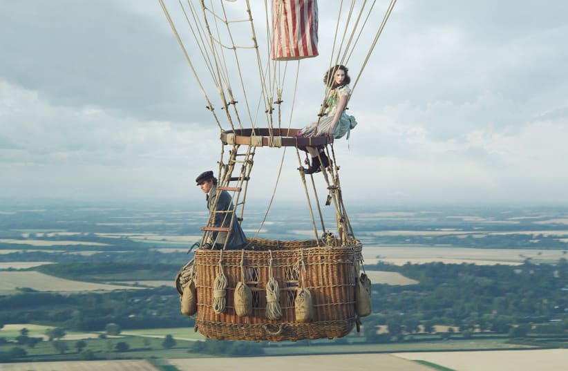 ‘THE AERONAUTS’ Cast: Felicity Jones, Eddie Redmayne, Himesh Patel,  Vincent Perez, Phoebe Fox. Directed by Tom Harper. Running time: 1 hour, 40 minutes. Rated PG-13 for some peril  and thematic elements. (photo credit: TNS)