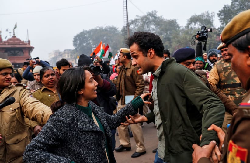 Demonstrators are detained during a protest against a new citizenship law, in Delhi, India, December 19, 2019 (photo credit: DANISH SIDDIQUI/ REUTERS)