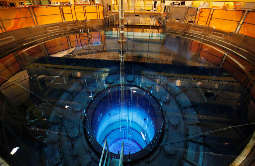 The open reactor with fuel rods are seen in a water pool inside the nuclear power plant Muehleberg during a yearly revision in Muehleberg, Switzerland August 16, 2012. (photo credit: RUBEN SPRICH / REUTERS)