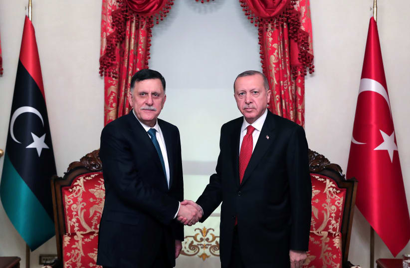 Turkish President Tayyip Erdogan meets with Libya's internationally recognised Prime Minister Fayez al-Sarraj in Istanbul, Turkey, November 27, 2019. Picture taken November 27, 2019 (photo credit: PRESIDENTIAL PRESS OFFICE/HANDOUT VIA REUTERS)