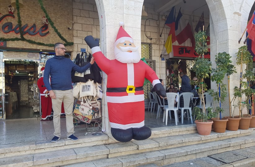 Store owners in Bethlehem (photo credit: KHALED ABU-TOAMEH)