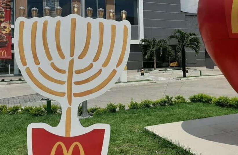 The 7-foot-tall, nine-branched candelabrum made of iron in the front yard of the Jewish-owned fast-food restaurant (photo credit: MARCUS M. GILBAN/JTA)