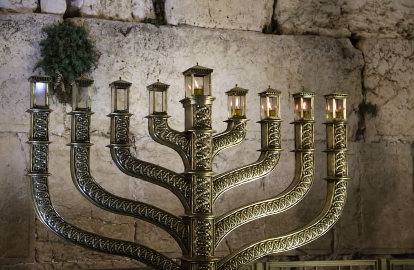 A fourth Hanukkah candle is lit at the Western Wall  (photo credit: WESTERN WALL HERITAGE FOUNDATION)